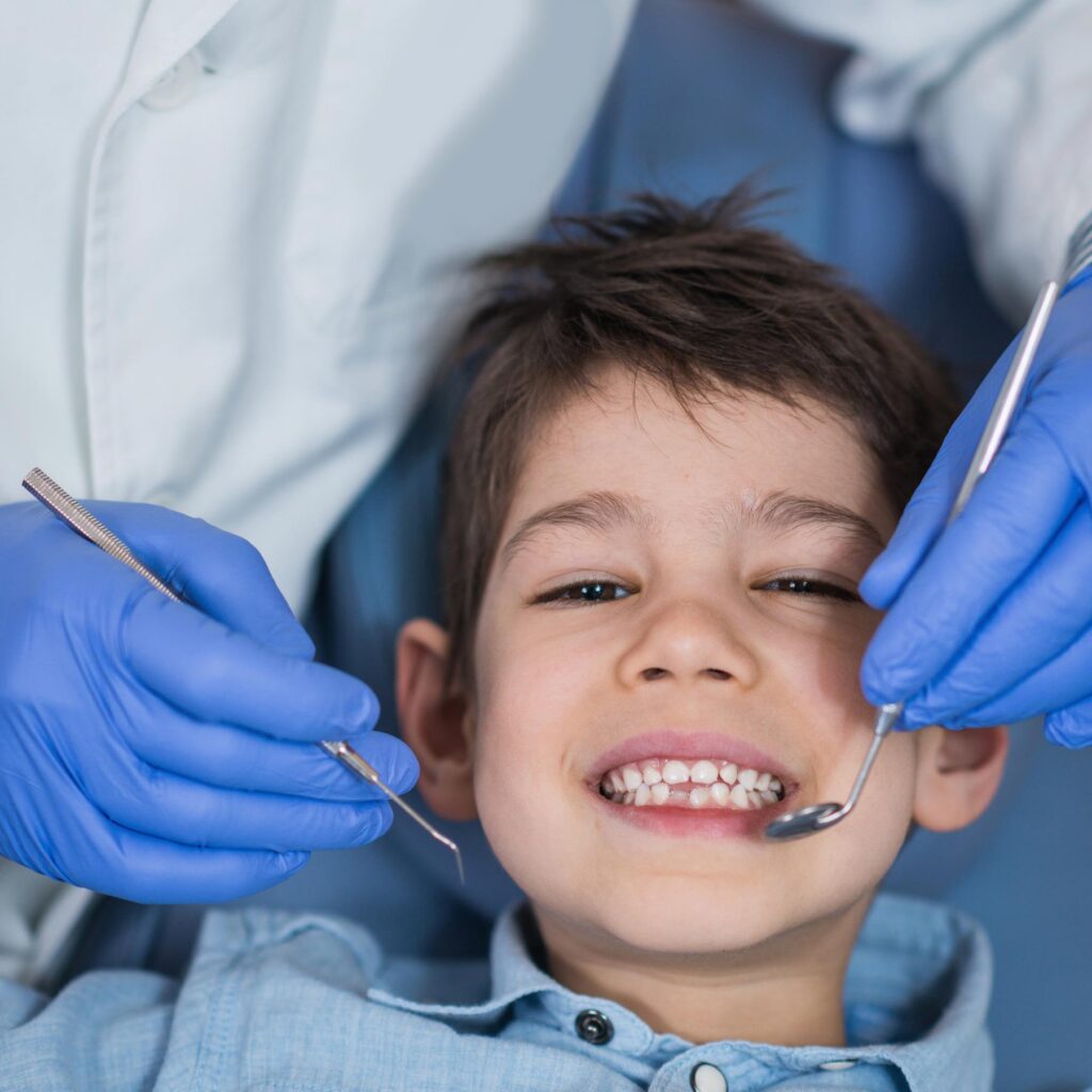 Dentist applied fluoride coating on a child teeth
