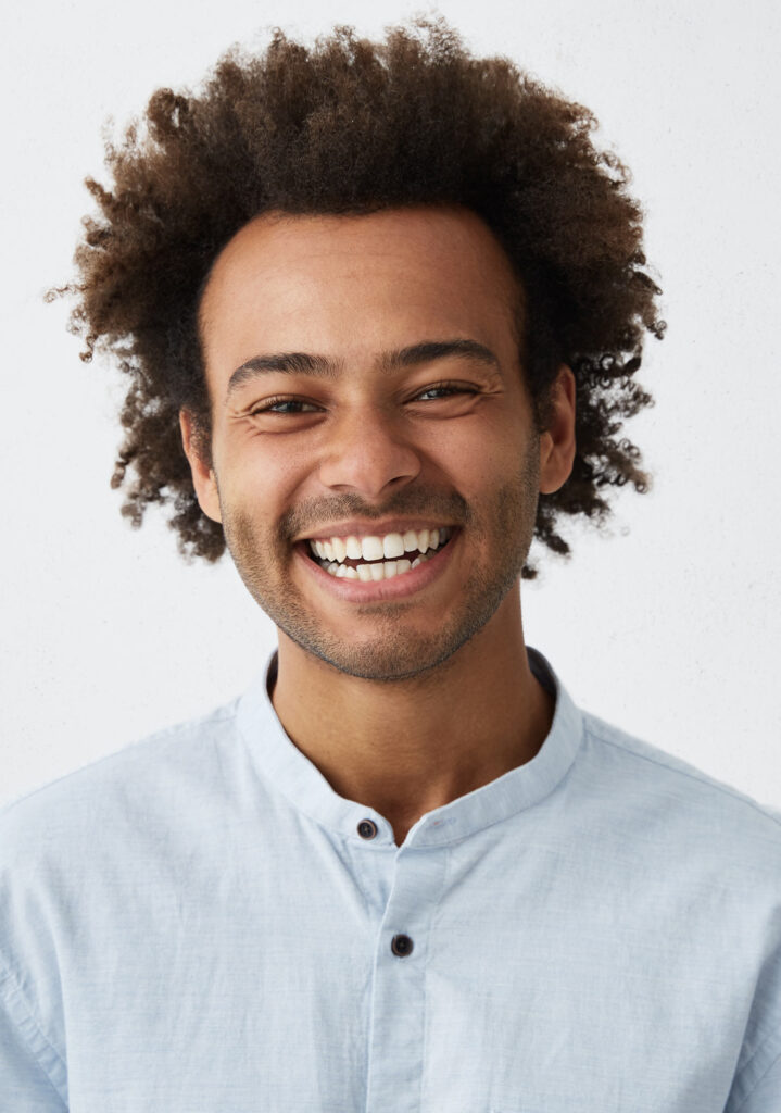 African man smiling confidently after dental treatment - Park Royal Dental Clinic near Acton.