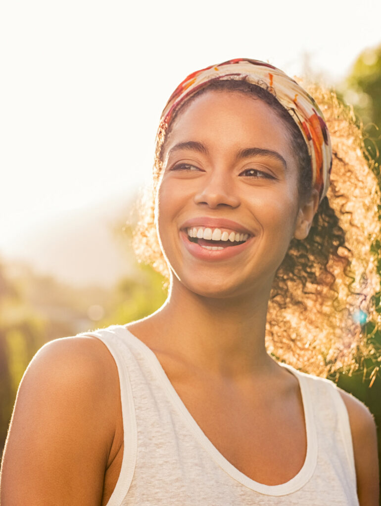 A woman smiling with perfect smile - dentist ealing